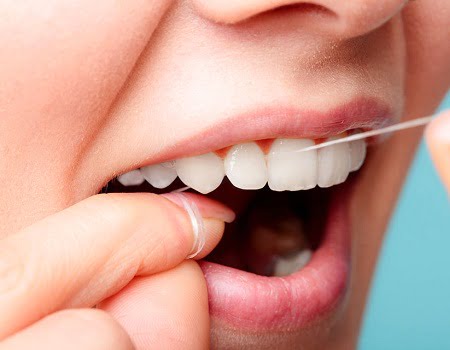 cách sử dụng chỉ nha khoa để loại bỏ cao răng